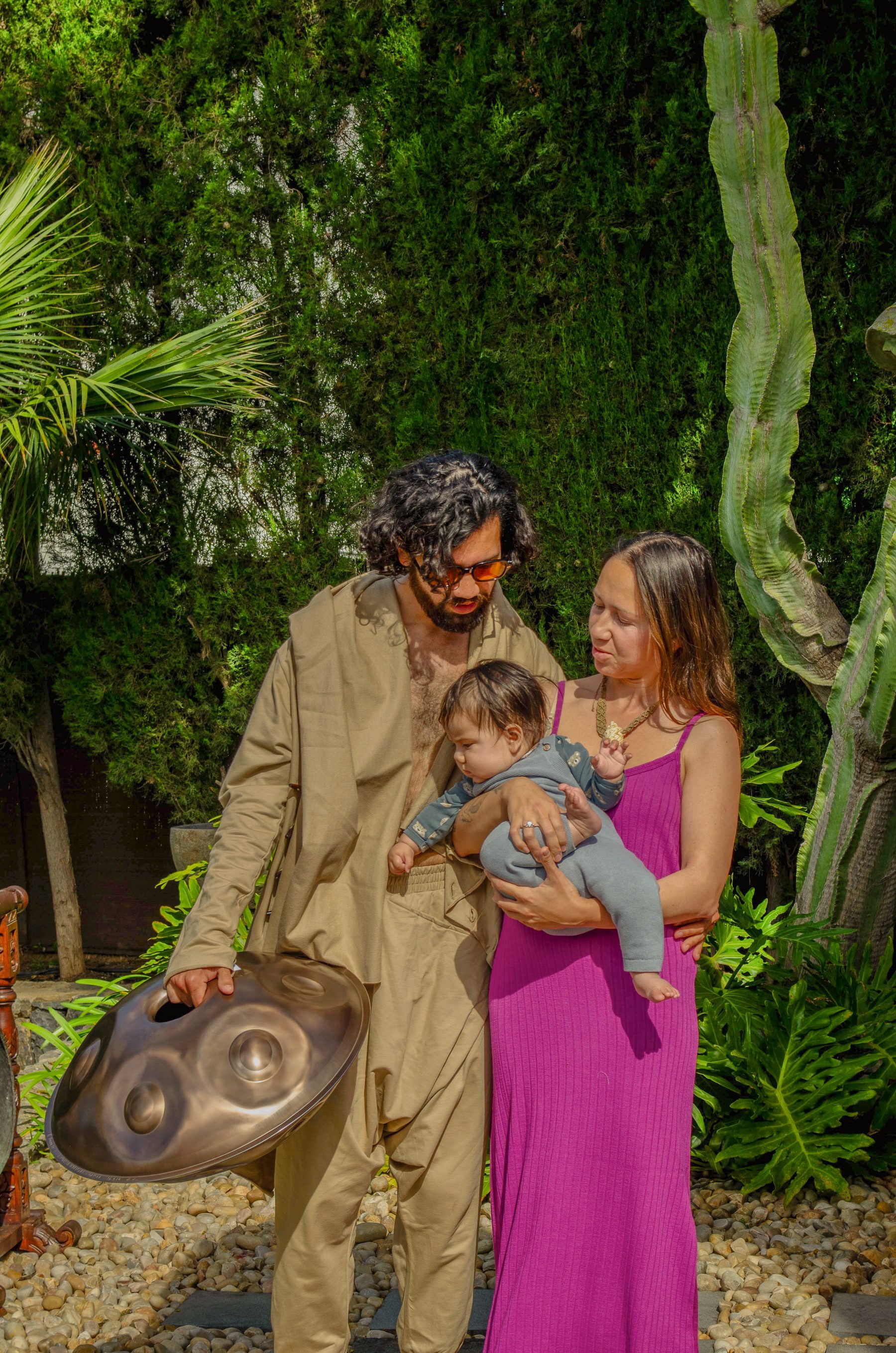 A family sharing the handpan together
